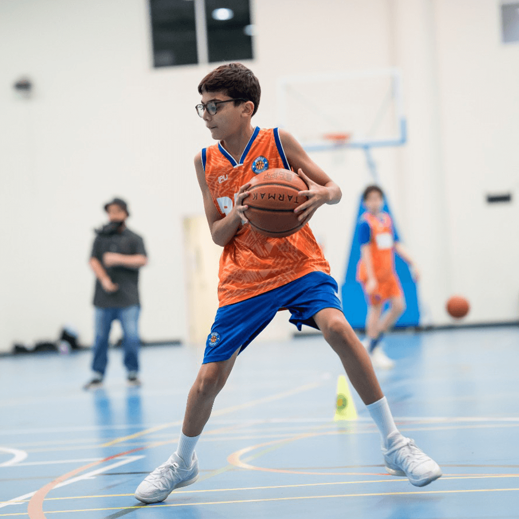 basketball player in glasses doing a side step